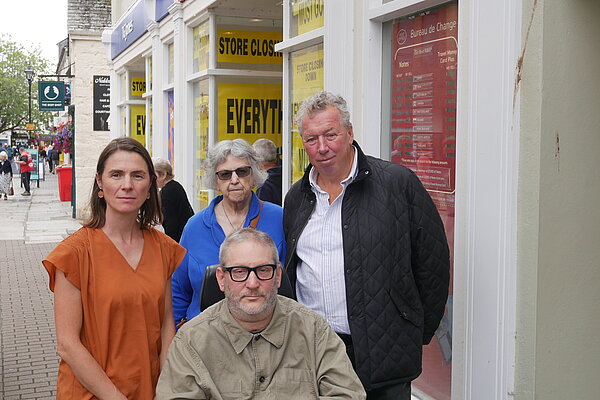 Local Lib Dem Councillors stood outside the Post Office on Pydar Street in Truro which is threatened with closure.