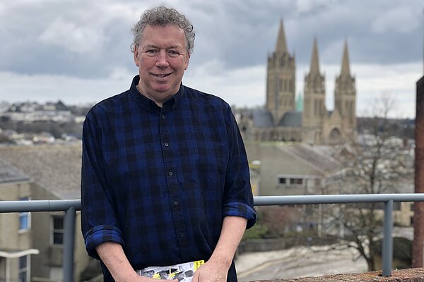 Councillor Rob Nolan looking at the camera with Truro Cathedral in the background